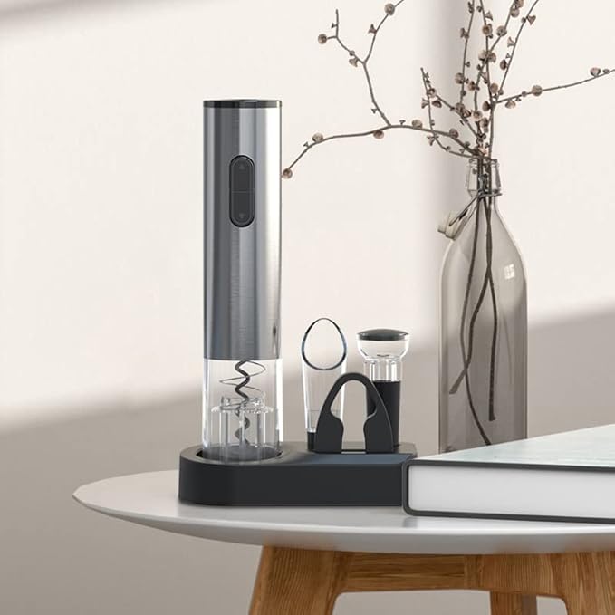 Automatic wine opener kit with accessories on a wooden table
